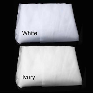 May include: Two pieces of white tulle fabric, one labeled "White" and the other labeled "Ivory".