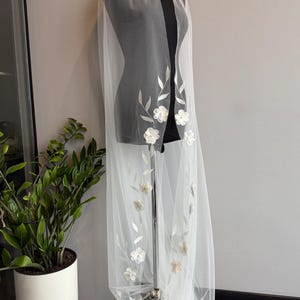 May include: A trio of ceramic mugs with a speckled, matte finish in light blue, cream, and grey. The mugs have a simple, modern design with a rounded shape and a comfortable handle. Ideal for tea or coffee.