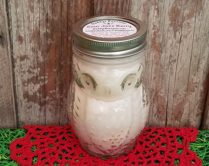 Sour Jazz Berry: 15 oz Scented Natural Air Purifying Beeswax & Coco Crème Wax Candle With a Wood Wick in a clear Owl Jar
