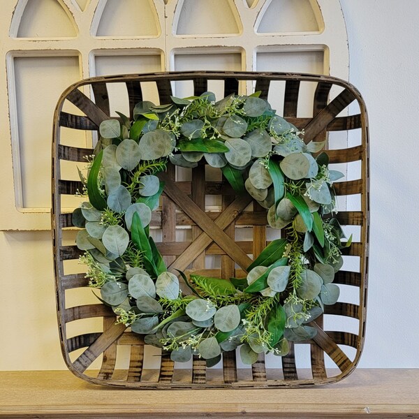 24.5" W Tobacco Basket with Eucalyptus  Wreath Wall hanging above mantle fireplace decoration