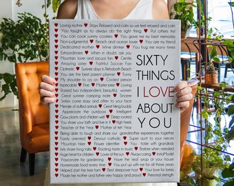 May include: A canvas print with the words "Sixty Things I Love About You" in black and red text. The print is surrounded by a list of loving attributes and phrases, each accompanied by a red heart symbol.