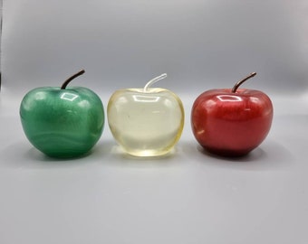 Resin, life sized apple paperweight/ shelf or table ornament in either red, green or clear. Great as teacher gifts.