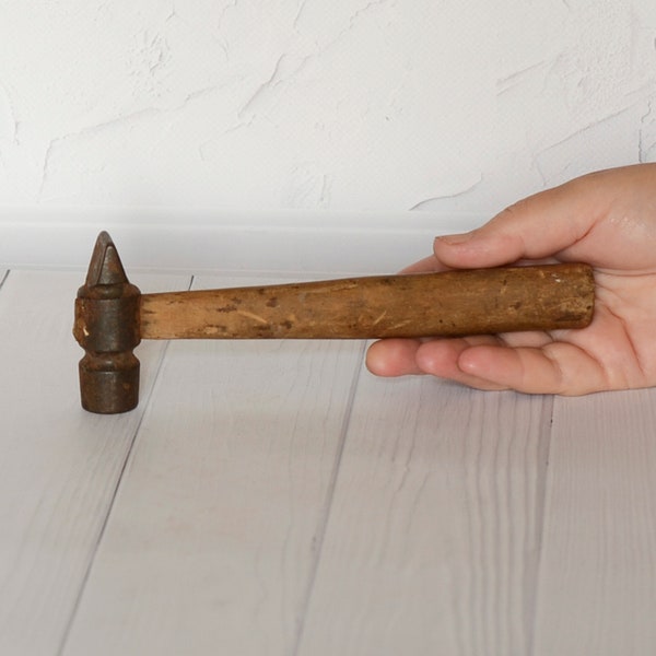 Old rusty hammer Wood handle hammer Soviet primitive hand tool