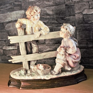 Capodimonte Figurine: Boy and Girl with Puppies, B Merli, Mahogany Base