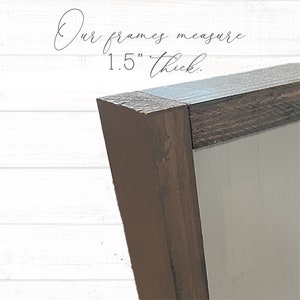 May include: Close-up of the corner of a brown wooden frame. The frame is 1.5 inches thick.