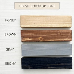 May include: Four wood samples showing different frame colour options: honey, brown, grey, and ebony.