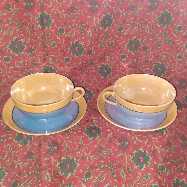 Set of 2 blue and orange lustreware cup and saucer