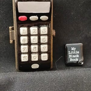 PHB (porslinsskrin med gångjärn) mobiltelefonskrin med liten svart bok