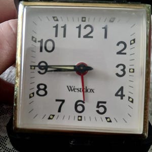 Vintage Westclox reseklocka i svart, musselfärgad, uppdragbar väckarklocka