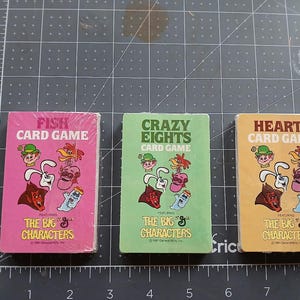 Jogos de cartas vintage General Mills, novos na embalagem original. Vendidos separadamente.