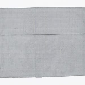 May include: A rectangular light gray fabric pouch with a visible woven texture. The item features a horizontal flap that folds over the main body, creating a clean, simple design with a consistent monochromatic color throughout the entire piece.