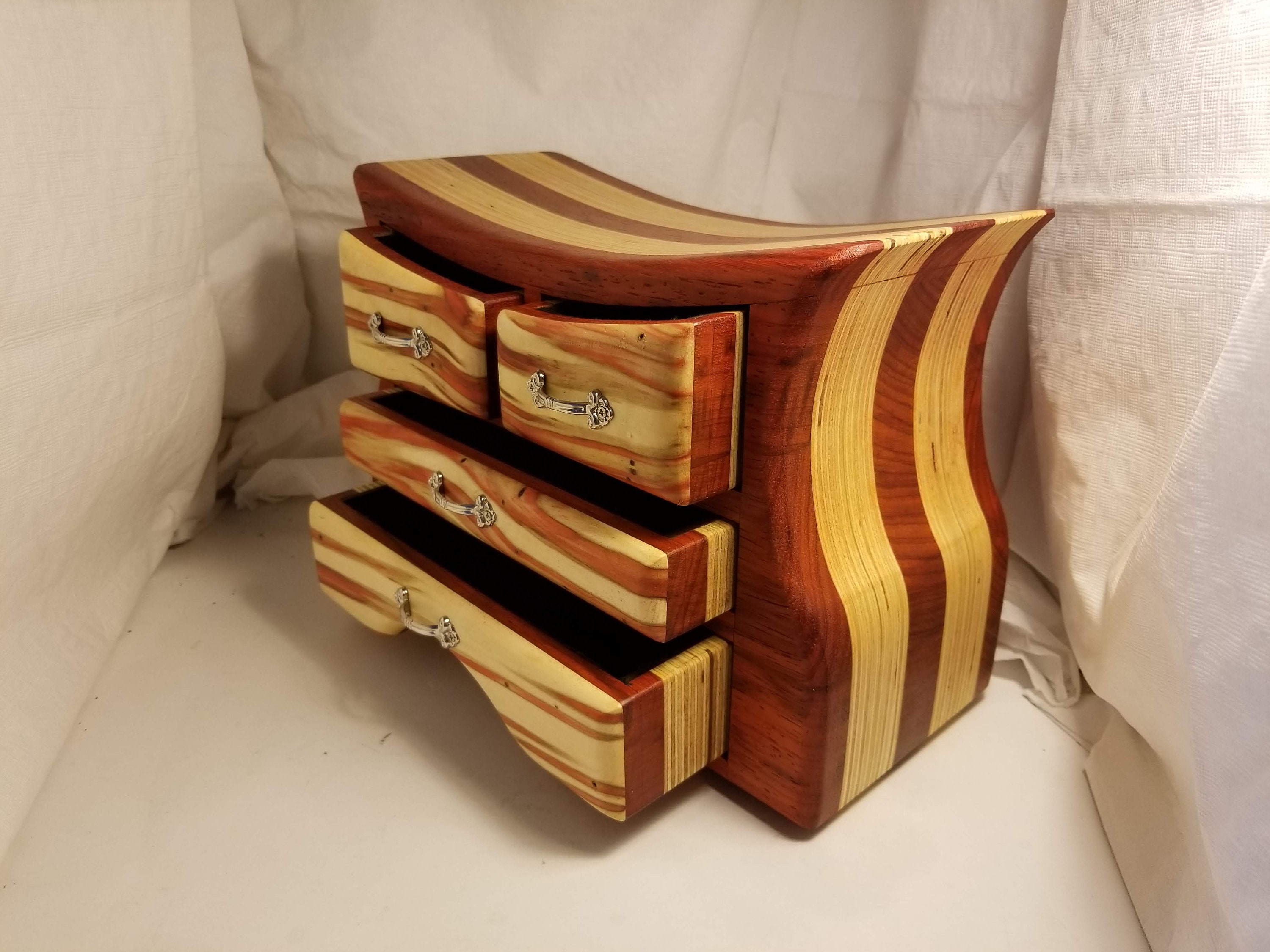 Bandsaw box made from padauk, red flame box elder, and plywood