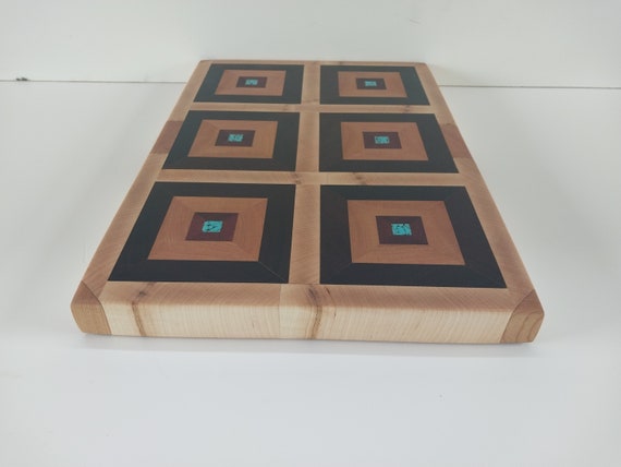 Endgrain cutting board made from rosewood, mahogany, cherry, maple, and acrylic