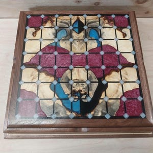 8 ring Tak box set made from walnut, buckeye burl, and resin