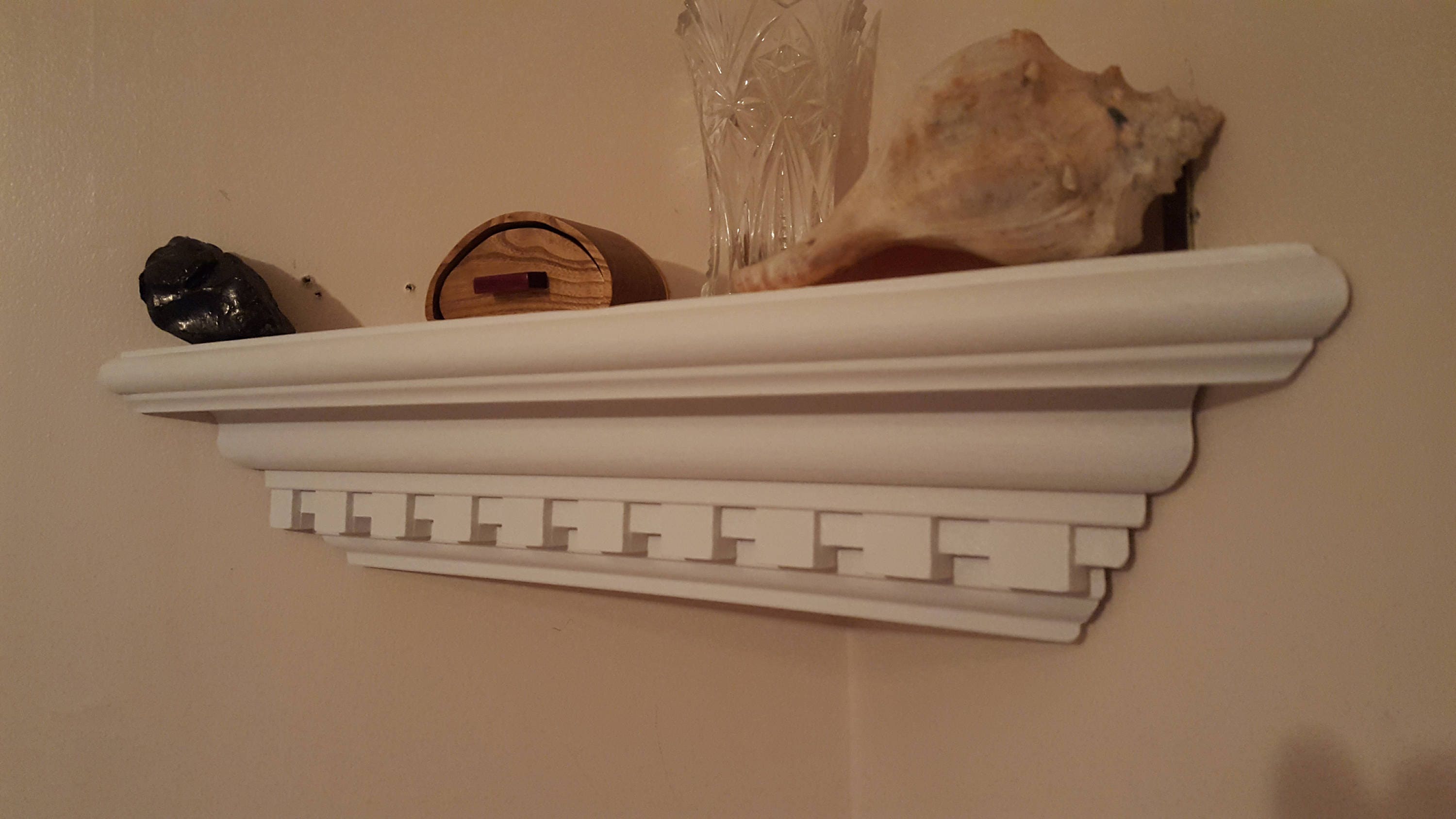 Crown molding corner shelf with dental detail in white