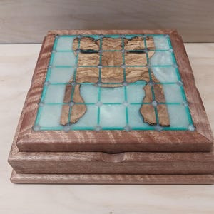 Tak box set made from olive wood, fiddleback mahogany, and resin with game pieces of ipe and maple