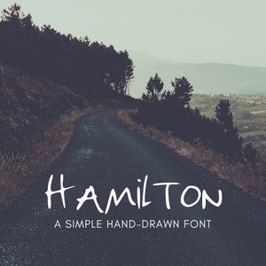May include: A winding road through a forest with a handwritten font that says "HAMILTON" and the text "A SIMPLE HAND-DRAWN FONT" below it.