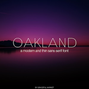 May include: A digital graphic with the word "OAKLAND" in white, thin sans serif font, above the text "a modern and thin sans serif font." The background is a gradient of purple and dark blue, with a silhouette of mountains and water.