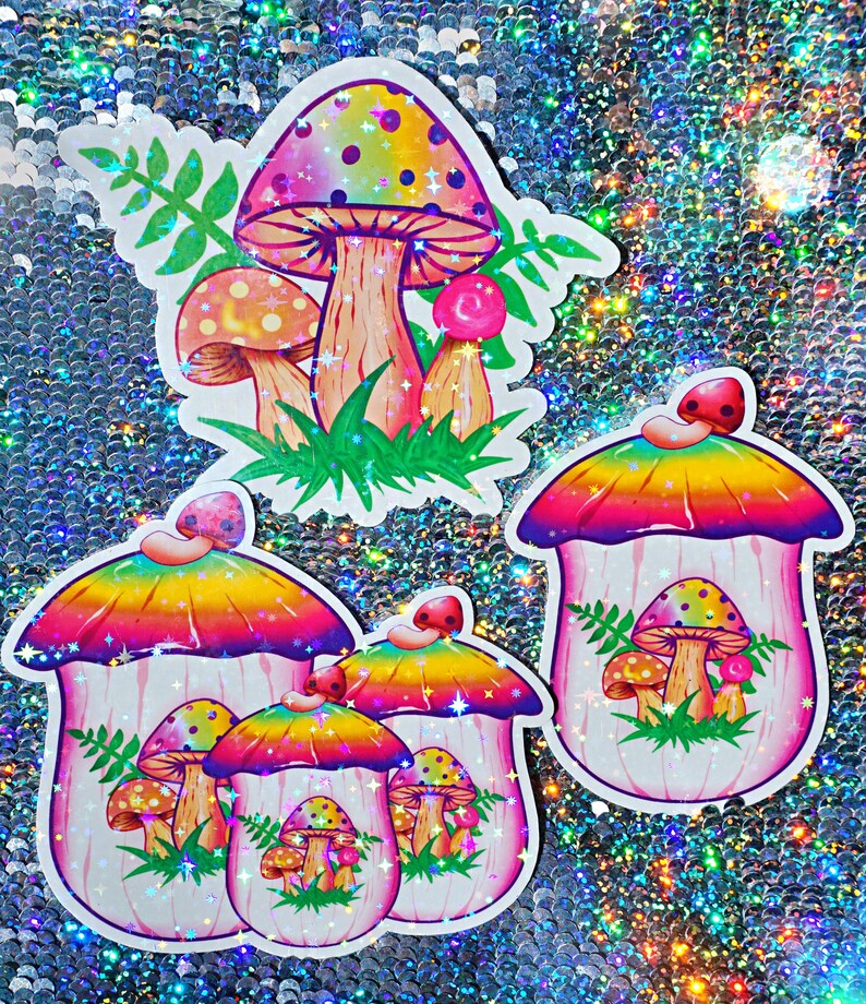 May include: A collection of colorful mushroom stickers with a holographic finish. The stickers feature vibrant designs with rainbow-colored caps, detailed gills, and green grass accents. The stickers vary in size and shape.