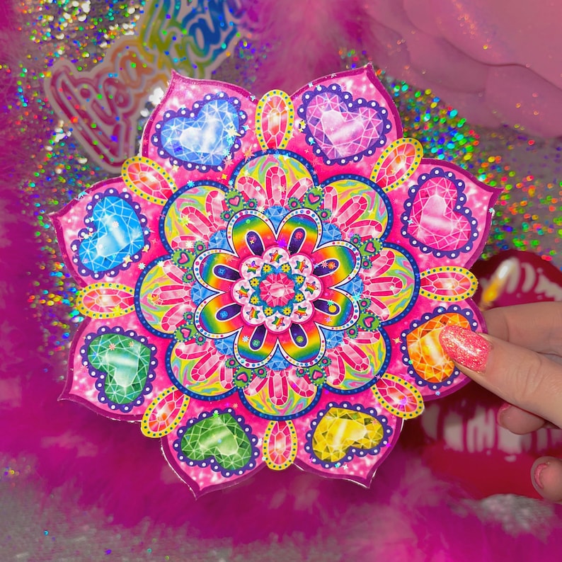 May include: A pink and rainbow mandala sticker with a flower design and jewel-toned hearts. The sticker has a glossy finish and is perfect for adding a touch of whimsy to any surface.