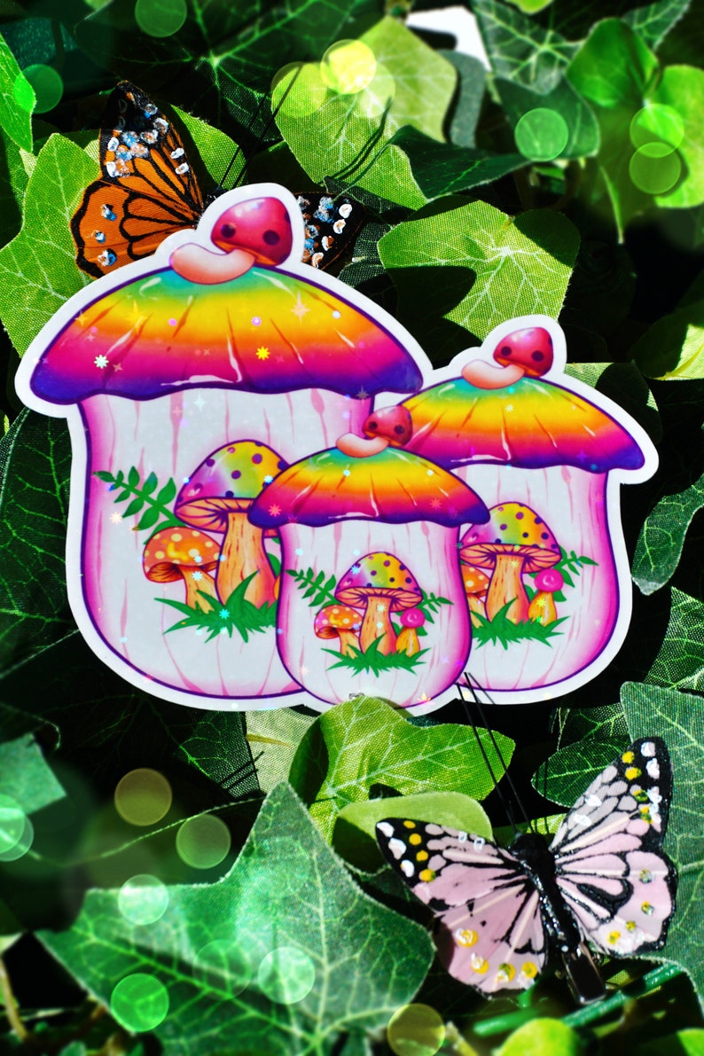 May include: Colorful mushroom stickers with rainbow tops and pink stems, featuring smaller mushroom illustrations inside. The stickers are surrounded by green leaves and butterflies with orange and pink wings.