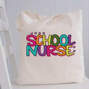 May include: A white canvas tote bag with the words "SCHOOL NURSE" printed in colorful, outlined letters. The letters are in different colors, including pink, orange, yellow, green, and purple.