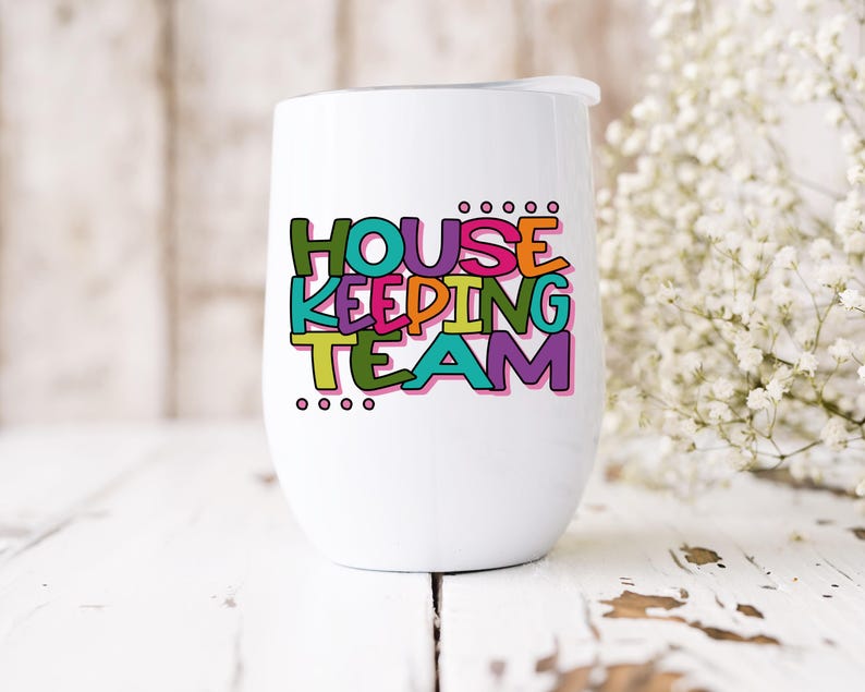 May include: White stainless steel wine tumbler with a colourful graphic that says "Housekeeping Team".