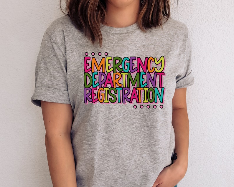 May include: A gray t-shirt with the text "EMERGENCY DEPARTMENT REGISTRATION" in colorful letters.
