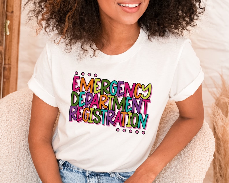 May include: White t-shirt with the text "EMERGENCY DEPARTMENT REGISTRATION" in colorful, outlined letters.