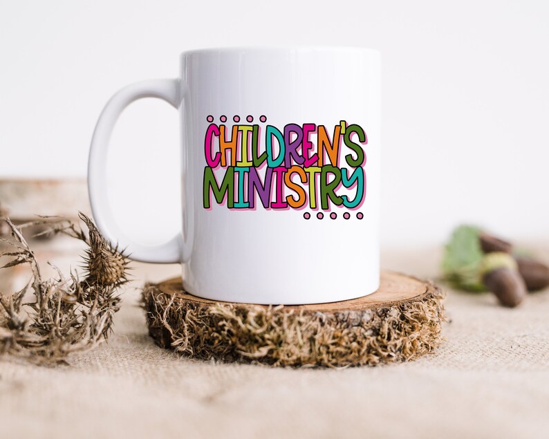 May include: White ceramic mug with a colorful graphic that says "CHILDREN'S MINISTRY".