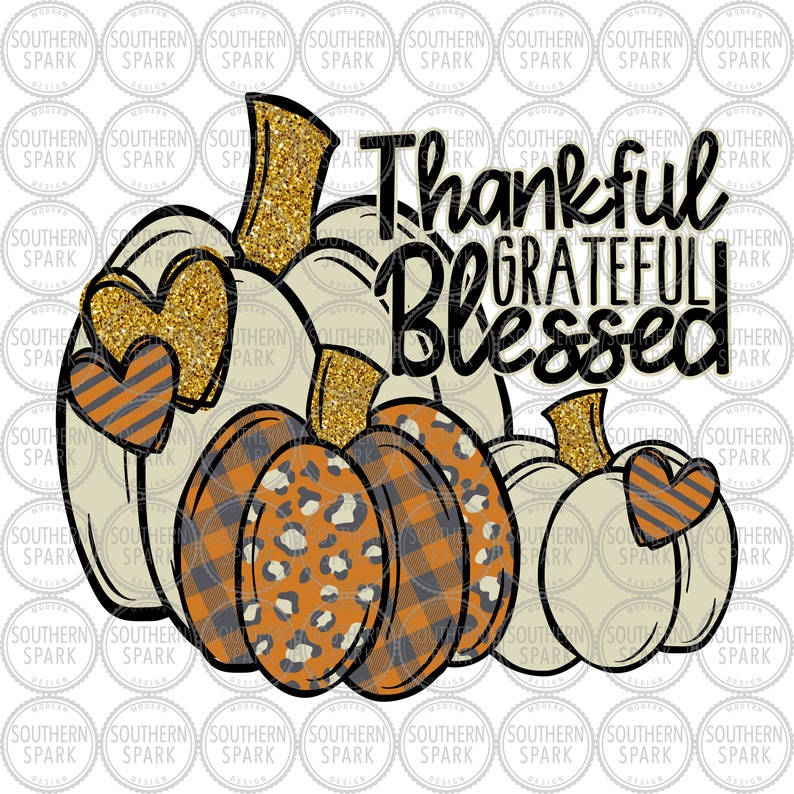 May include: Three white pumpkins with black outlines and different patterns. The pumpkins are stacked on top of each other. The top pumpkin has gold glitter. The middle pumpkin has a black and white checked pattern and a leopard print. The bottom pumpkin has a heart with black and white stripes. The text "Thankful Grateful Blessed" is written in black letters with gold glitter.