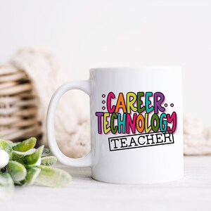 May include: White ceramic mug with a colorful design that says "Career Technology Teacher".