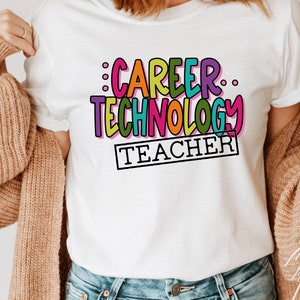May include: White t-shirt with a colorful graphic that says "Career Technology Teacher" in a playful font.