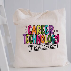 May include: A white canvas tote bag with the text "Career Technology Teacher" in colorful, outlined letters. The text is in a playful, handwritten font.