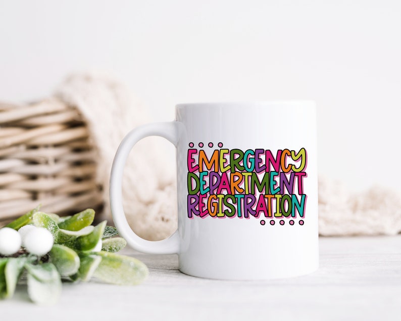 May include: White ceramic coffee mug with a colorful graphic that reads "EMERGENCY DEPARTMENT REGISTRATION".