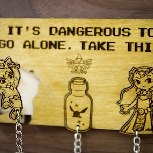 It's dangerous to go alone! Inspired Lasercut & Engraved keyring and wall mount