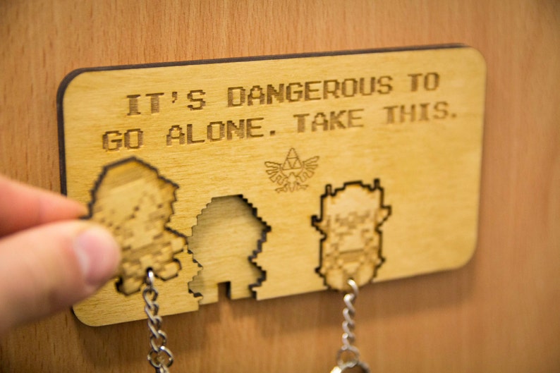 It's dangerous to go alone! Inspired Lasercut & Engraved keyring and wall mount 