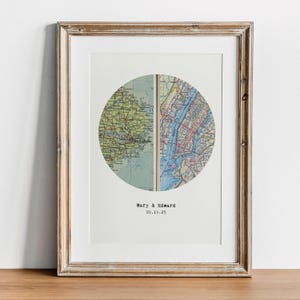 May include: Framed print featuring a circular map design. The map is split into two halves, one with a green and yellow map, the other with a blue and red map. The text "Mary & Edward" and "09.19.25" are printed below the map.