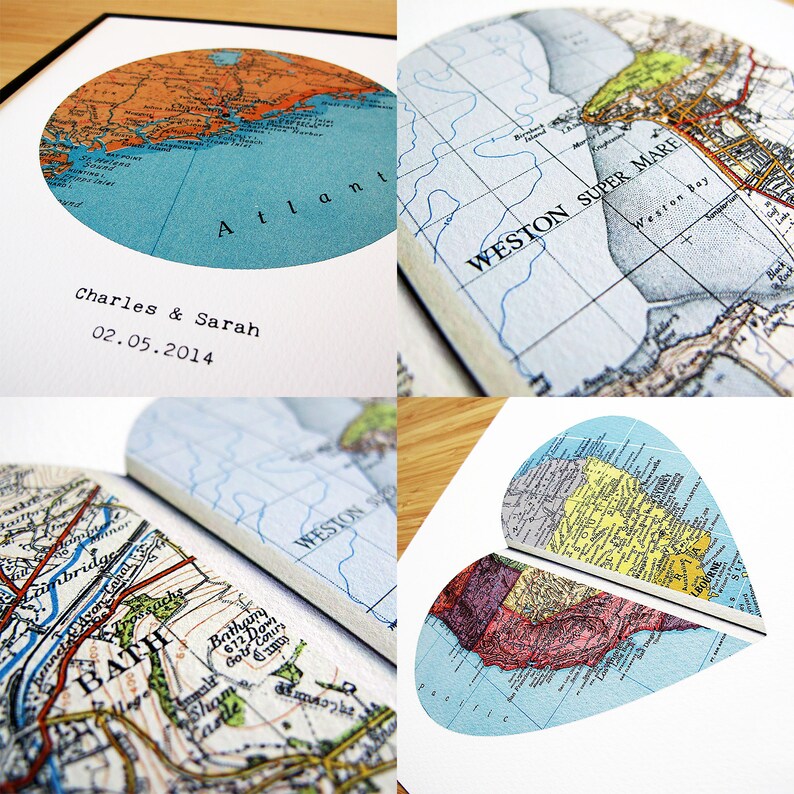 May include: A collage of map-themed art prints. One print is a circular map of the Atlantic, with the text "Atlant" and the names "Charles & Sarah" and the date "02.05.2014". Other prints are heart-shaped and irregular map cutouts.