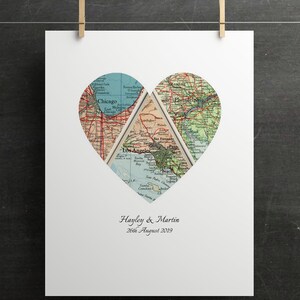 May include: A white print featuring a heart-shaped design composed of vintage map sections. The maps highlight Chicago, Los Angeles, and Philadelphia. The names "Hayley & Martin" and the date "26th August 2019" are printed below the heart.
