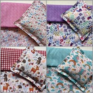 May include: Four fabric sets, each with a pillow and matching fabric. The sets feature floral, animal, and patterned designs in pink, purple, red, and blue. The pillows have a decorative edge.