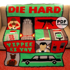 May include: A crochet blanket with a green and red color scheme featuring the movie "Die Hard" with images of John McClane, the Nakatomi Plaza, and the iconic line "Yippee-ki-yay".