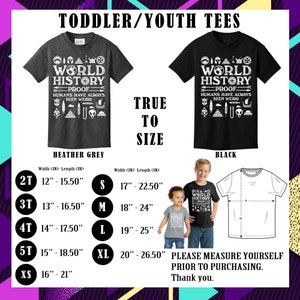 May include: Heather grey and black toddler/youth t-shirts with a graphic print of the text "World History Proof Humans Have Always Been Weird" surrounded by various symbols. Size chart included with measurements in inches.