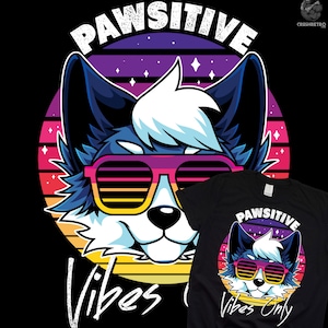 Puede incluir: Una camiseta negra con un diseño de estilo retro que presenta un lobo de dibujos animados con gafas de sol y el texto "Pawsitive Vibes Only".