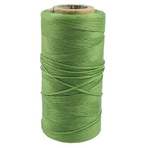 May include: A spool of green waxed thread for leather crafting.