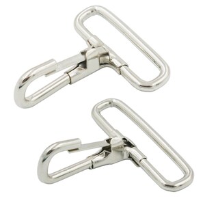 May include: Two silver metal swivel hooks with a rectangular loop on one end. The hooks are designed for attaching to straps or belts.