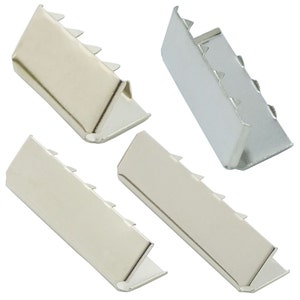 May include: Four silver metal strap ends with a serrated edge. The strap ends are in different sizes and angles.