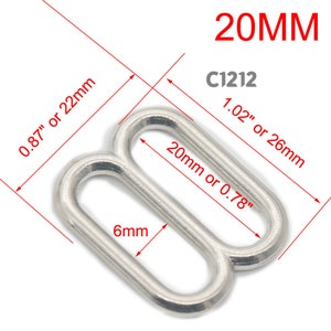 May include: Silver metal slider buckle with a 0.78 inch or 20 mm width and a 0.24 inch or 6 mm height. The buckle is labeled "C1212" and "20MM".