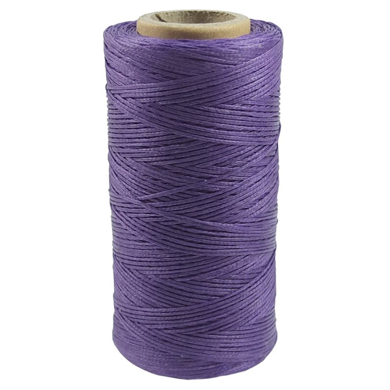 May include: A spool of purple waxed thread for leather crafting.