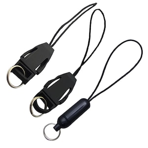 May include: Two black camera straps with a clip and a ring. One strap has a black magnetic clip.